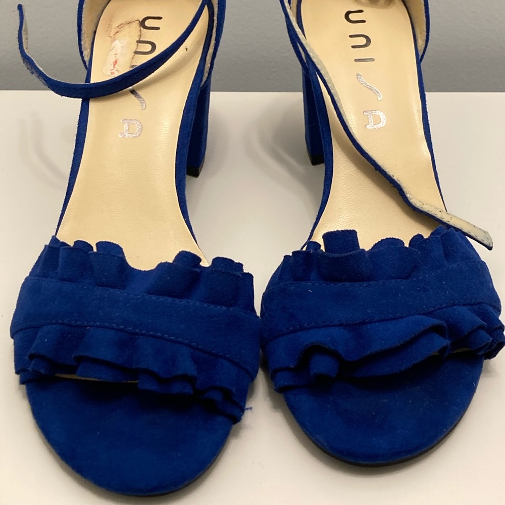 Blue heels with ruffle detail